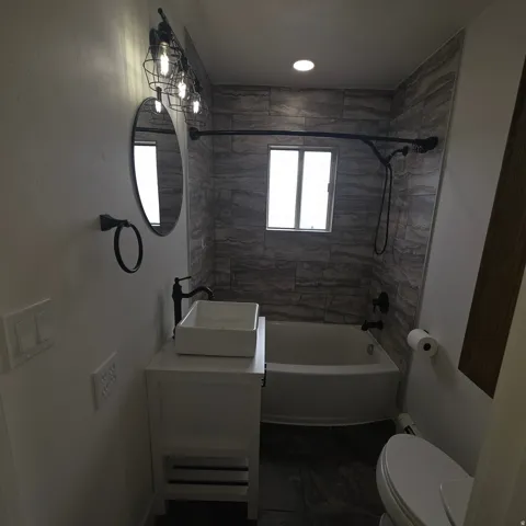 Full bathroom featuring vanity and bathtub / shower combination