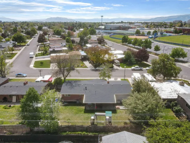 Aerial perspective of suburban area with a mountain backdrop