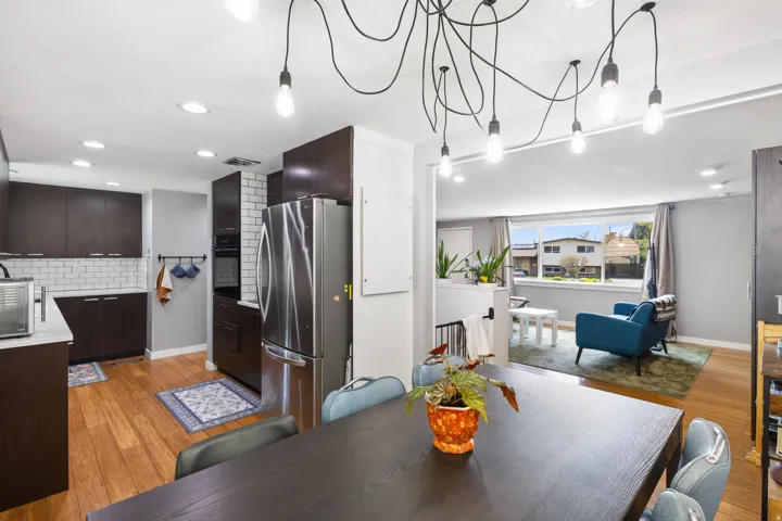 Dining space with light wood-type flooring and recessed lighting