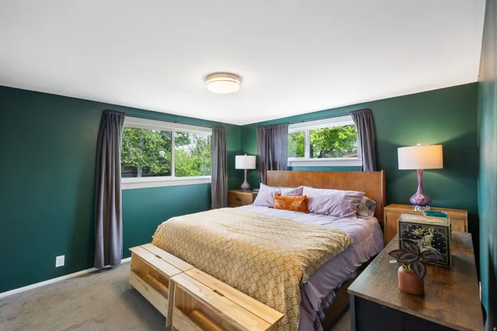 Carpeted bedroom with baseboards