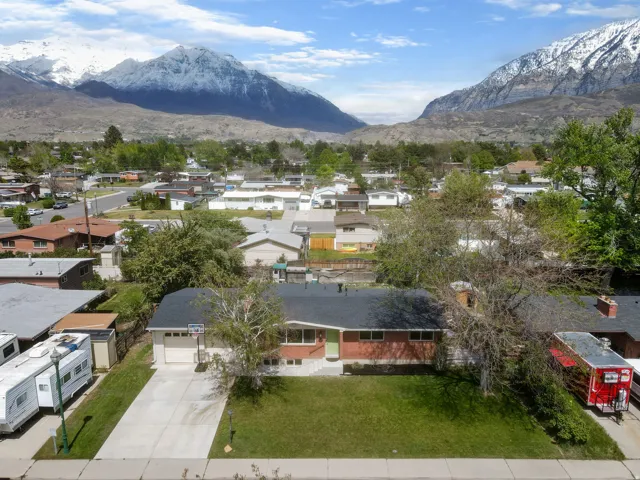 Aerial perspective of suburban area with a mountainous background