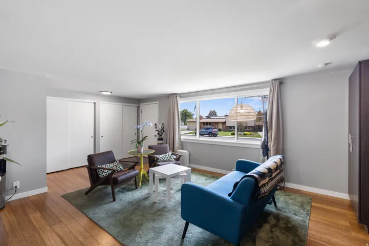Sitting room featuring wood-type flooring
