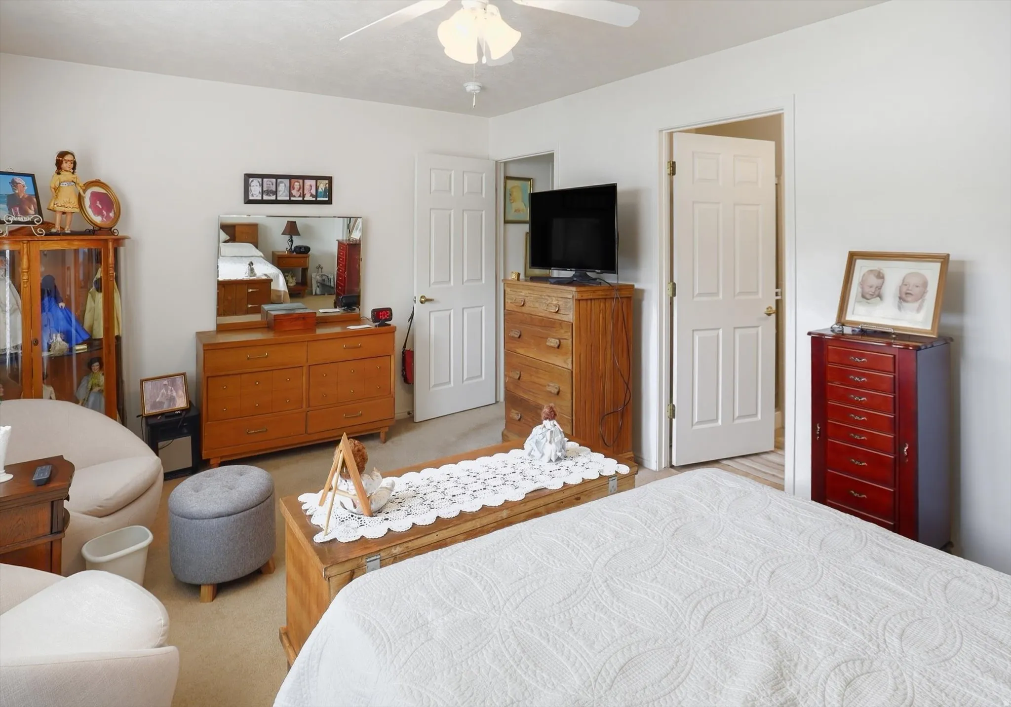 Neutral wall finishes with a ceiling fan