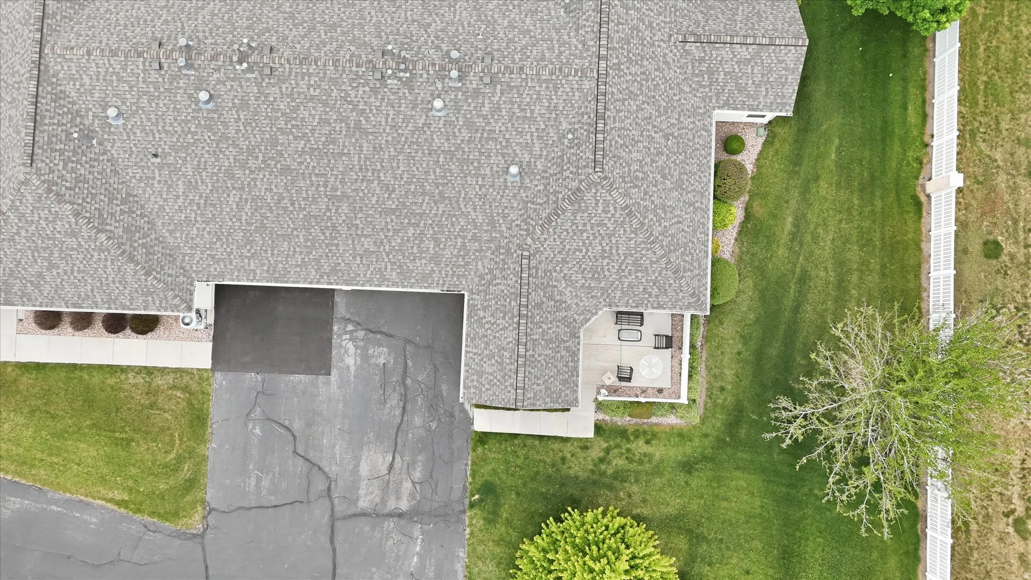 Asphalt shingle roof with multiple vents and skylights