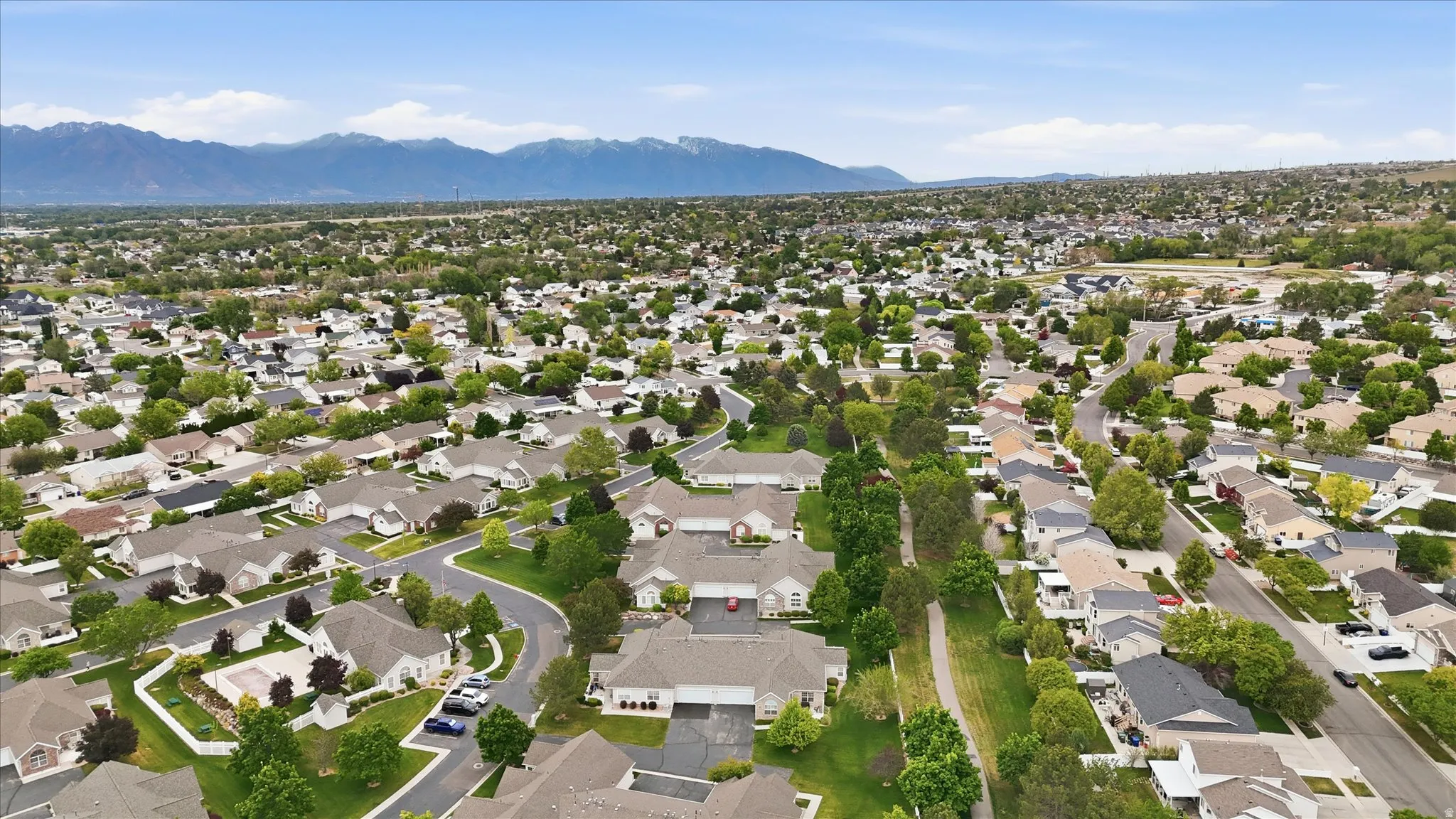 Expansive aerial perspective showcasing a residential development with varied housing styles