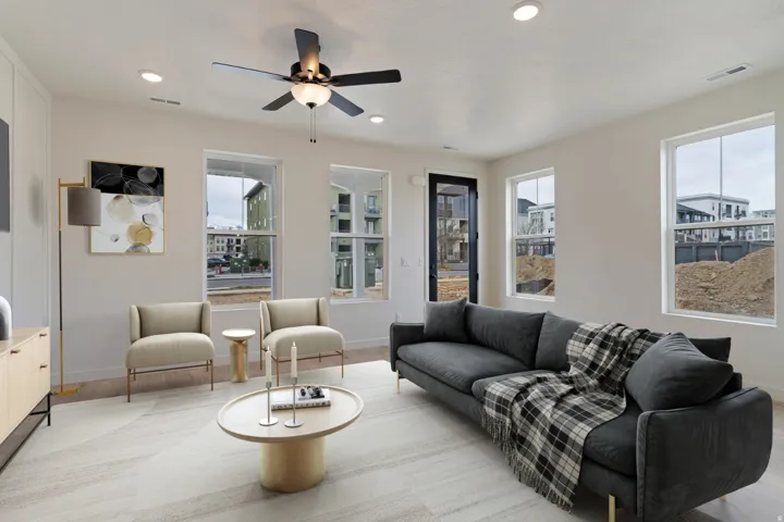 Living room featuring a ceiling fan, recessed lighting, and light wood-style flooring