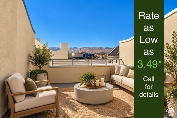 Rooftop deck featuring stucco walls, a metal railing, and a concrete patio surface