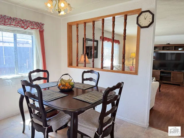 Dining space featuring hanging lights and baseboards