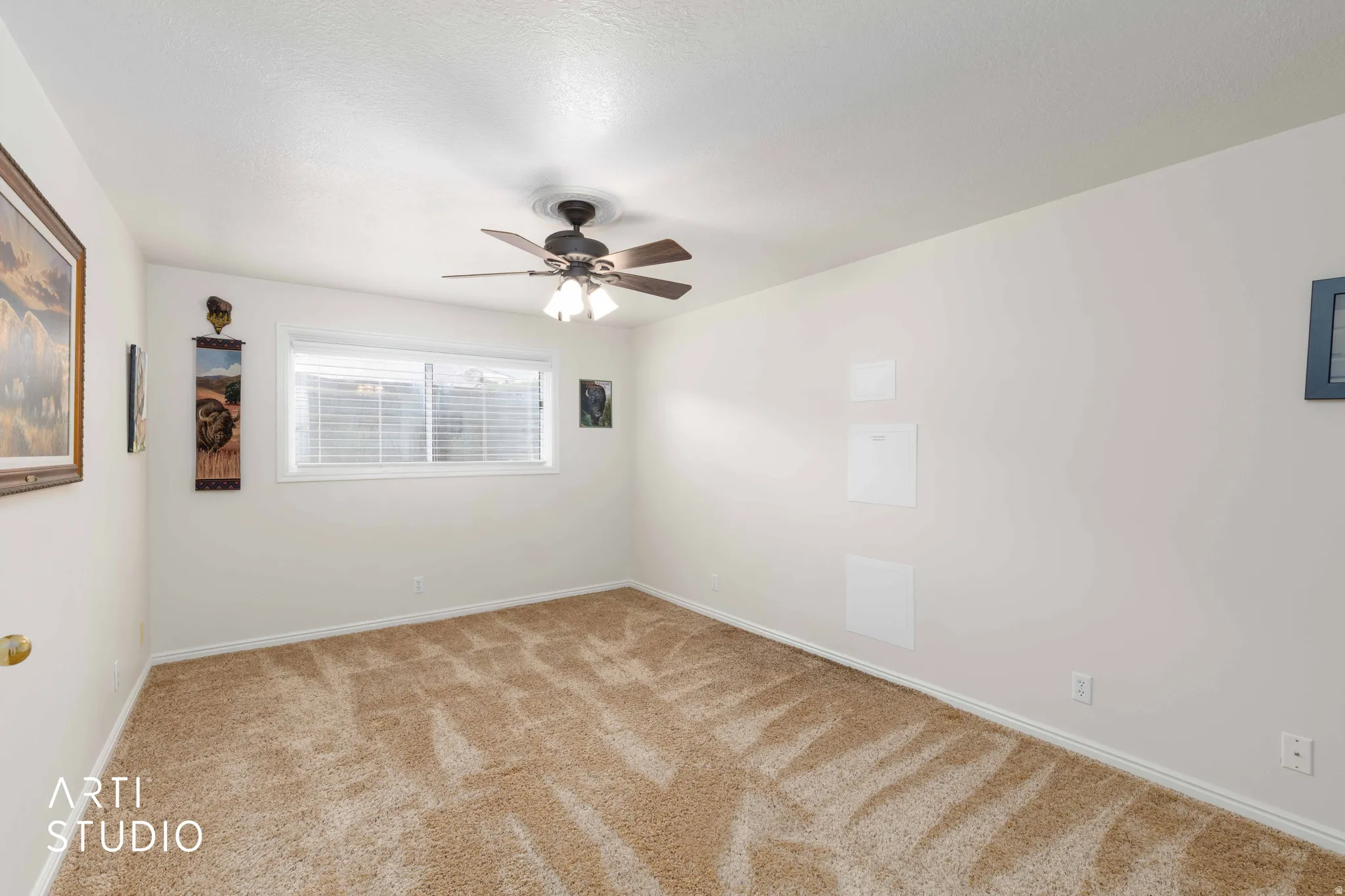 Unfurnished room with carpet floors and a ceiling fan