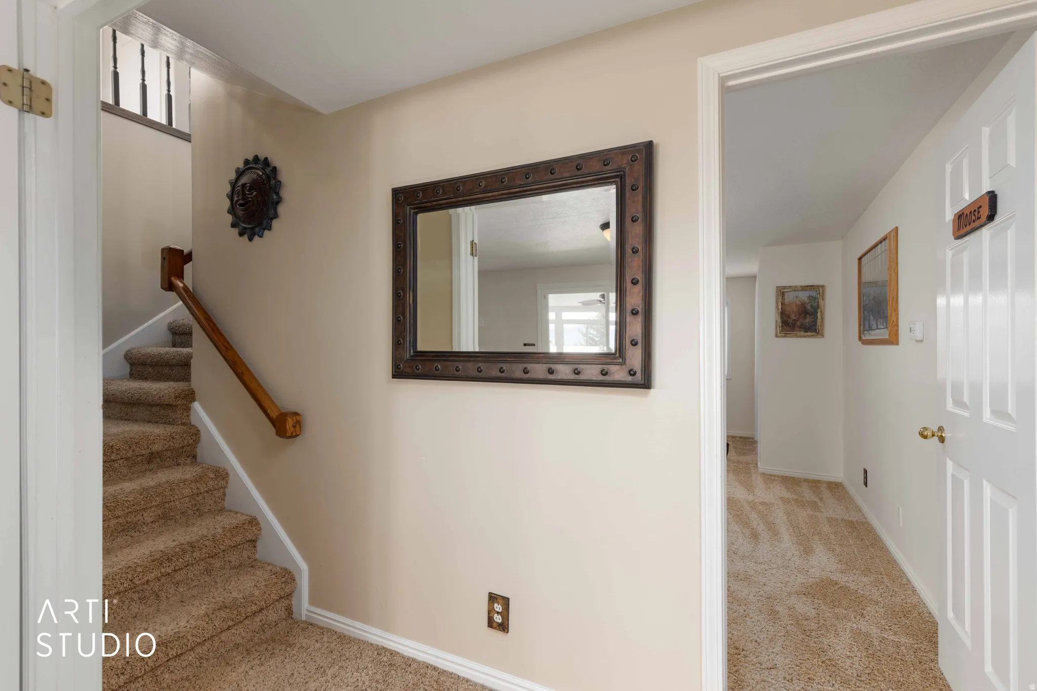 Staircase with carpet flooring and baseboards