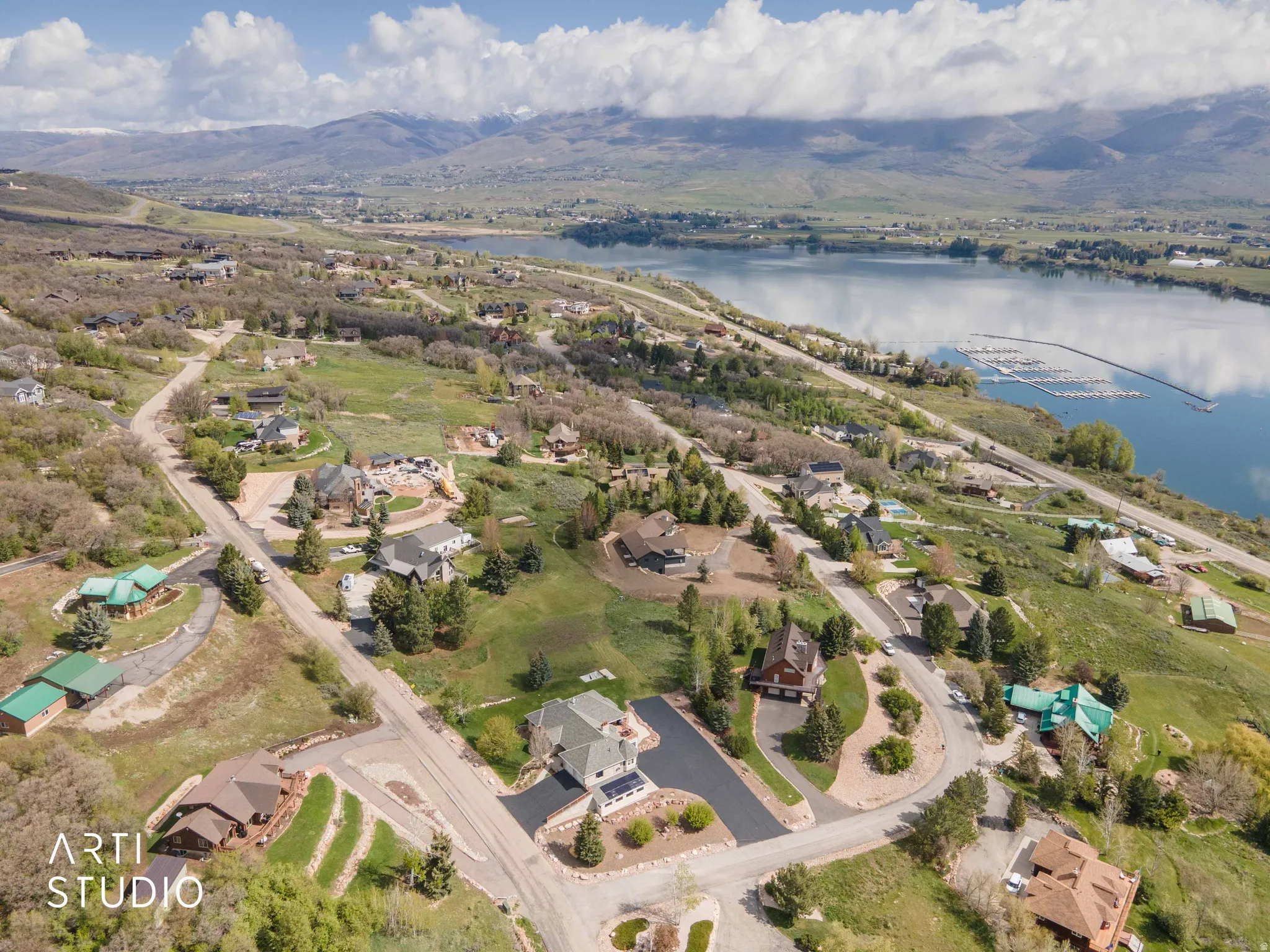 Aerial view of residential area featuring a water and mountain view