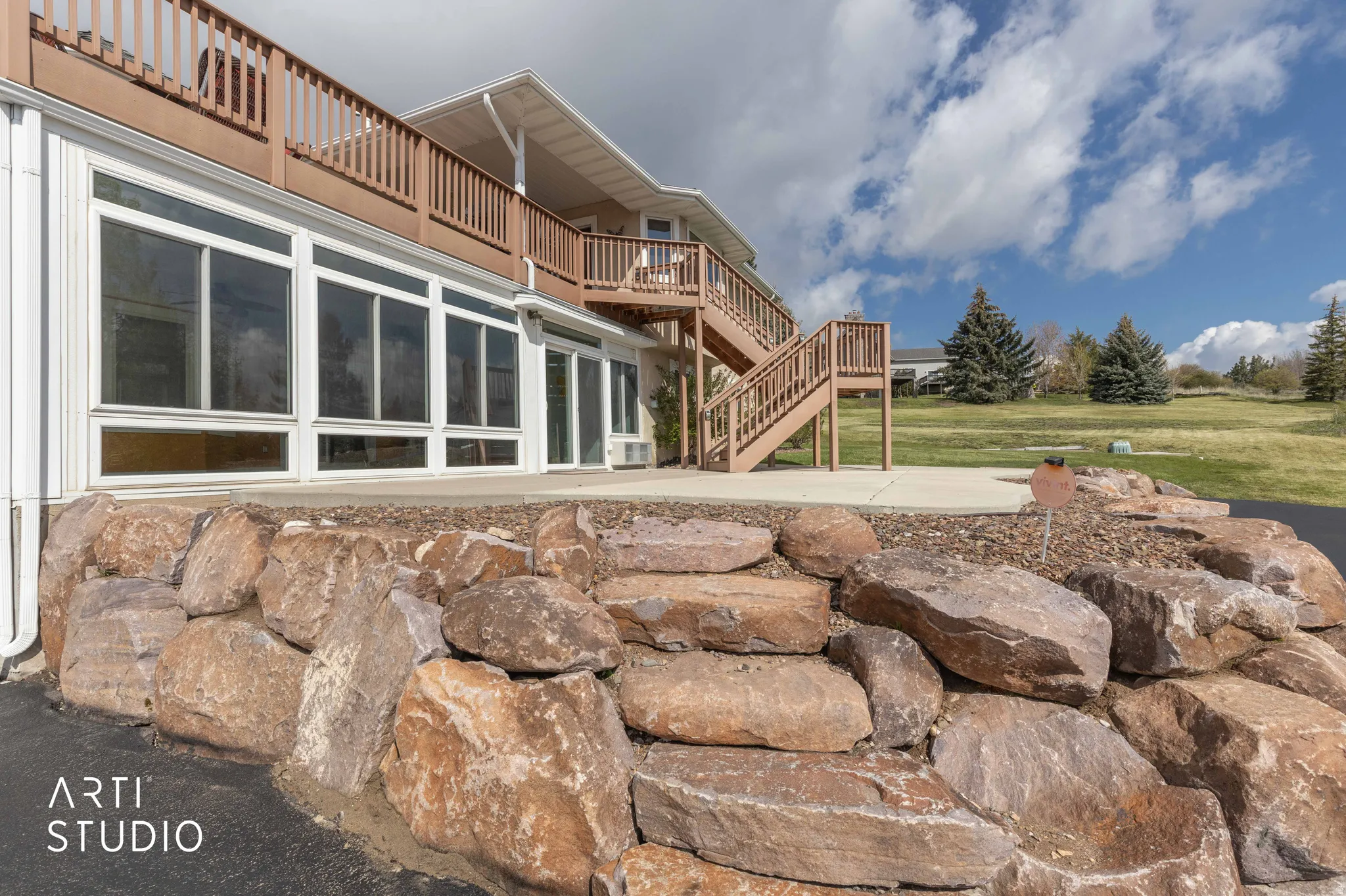 Exterior space with a deck and stairway