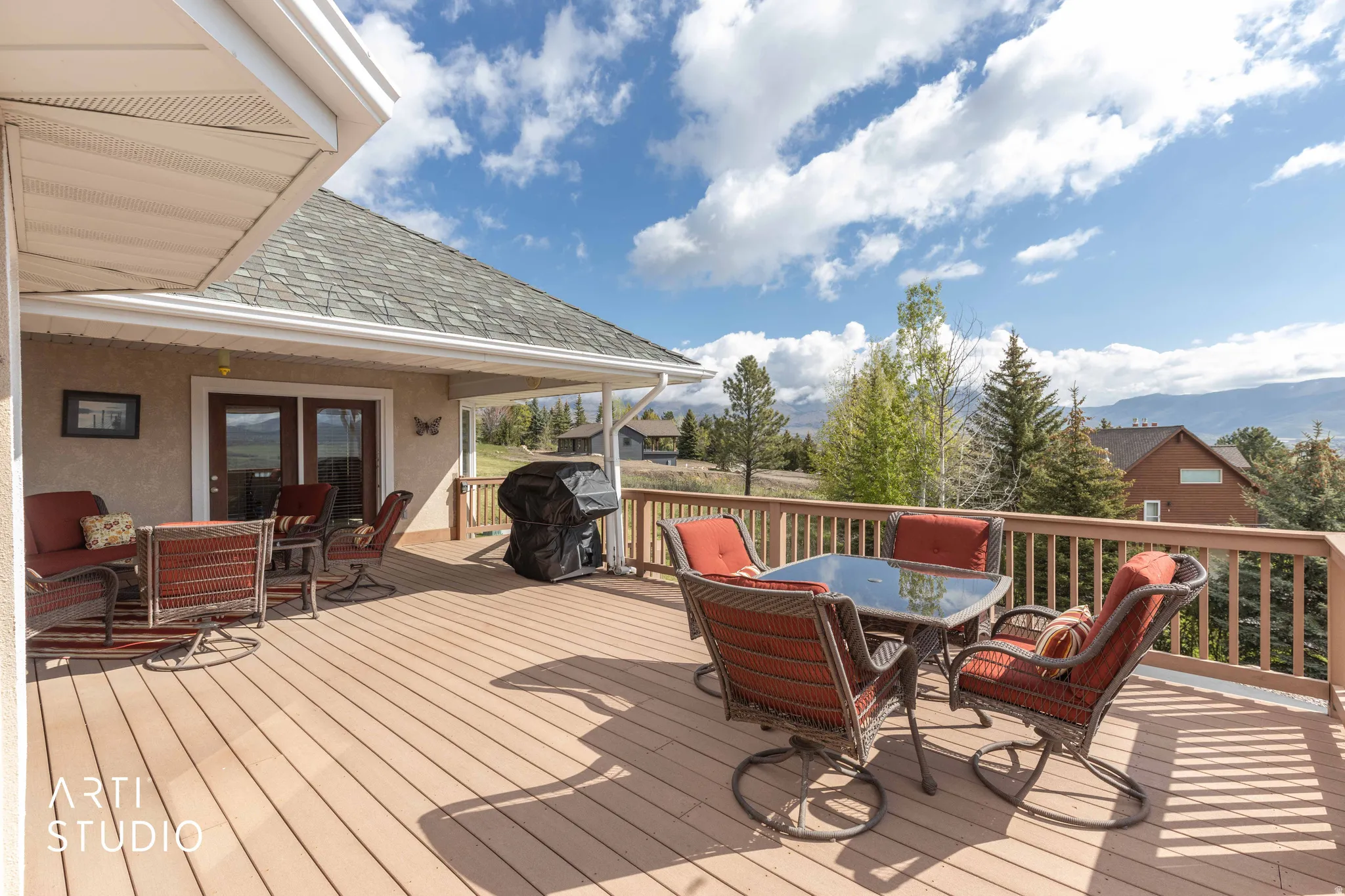 Wooden deck featuring an outdoor living / dining area and area for grilling
