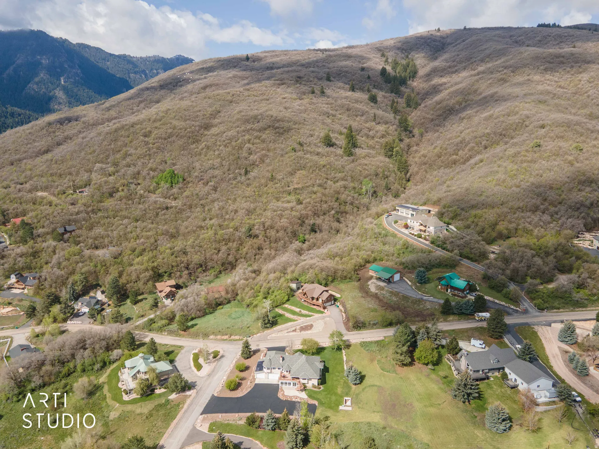 Aerial perspective of suburban area featuring mountains