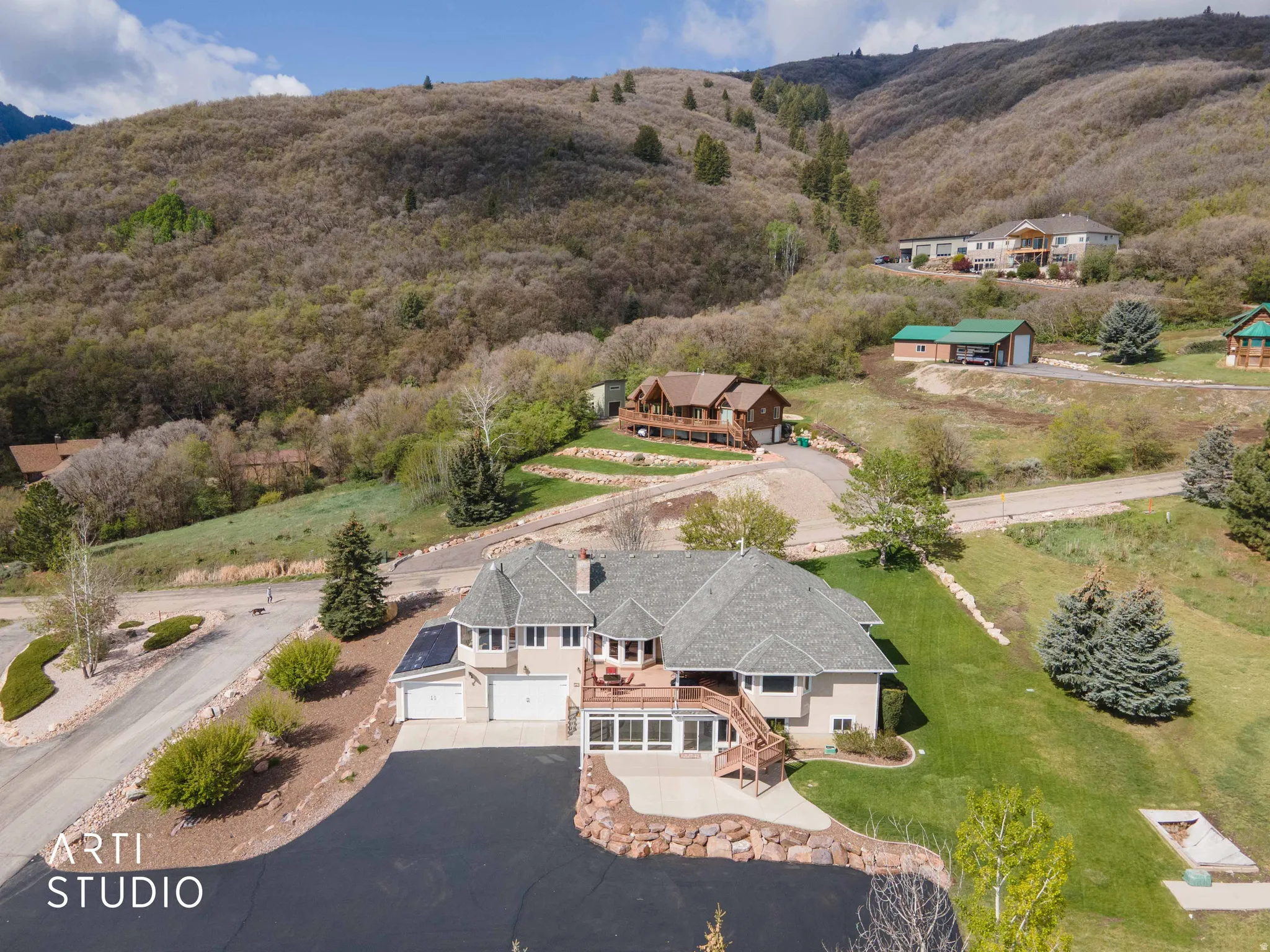 View of subject property featuring a mountainous background