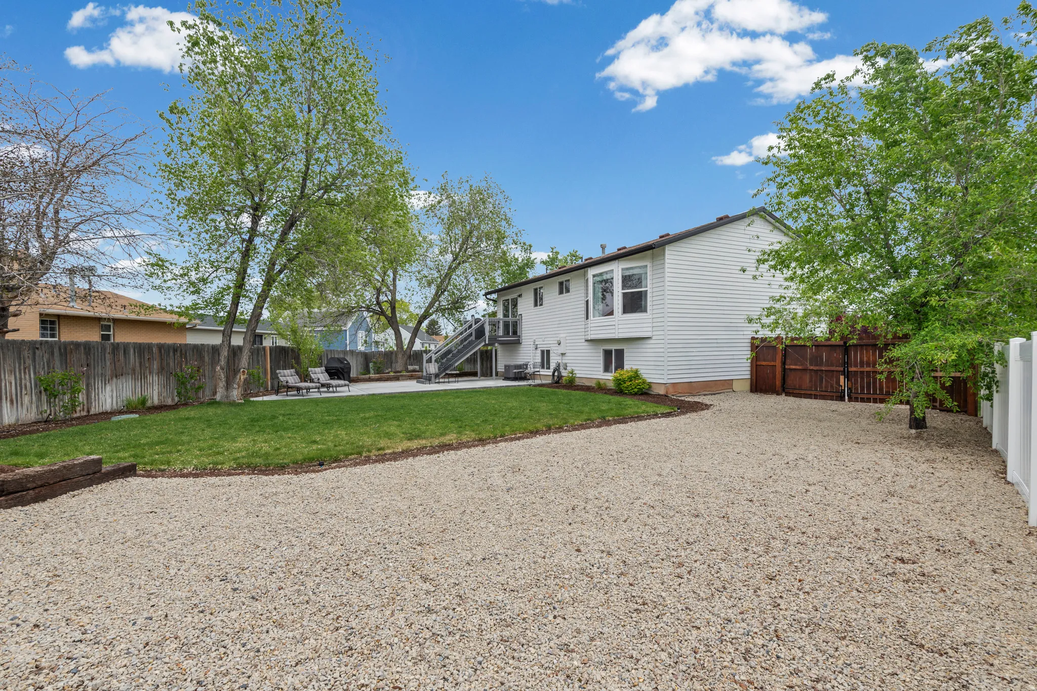 Back of property featuring a patio area and a fenced backyard