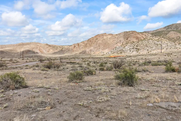 View of mountain backdrop featuring a desert landscape