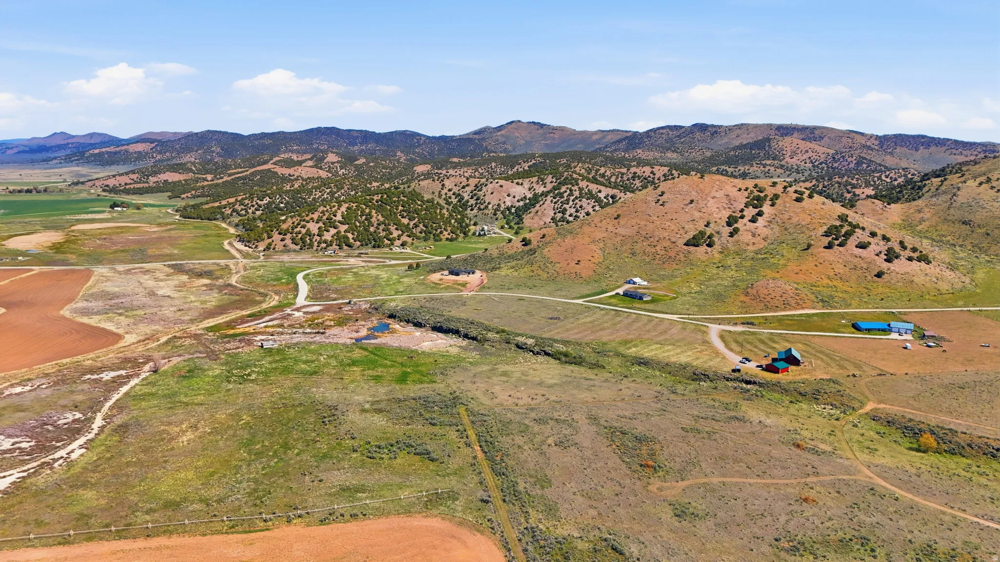 Overview of rural landscape featuring a mountain backdrop