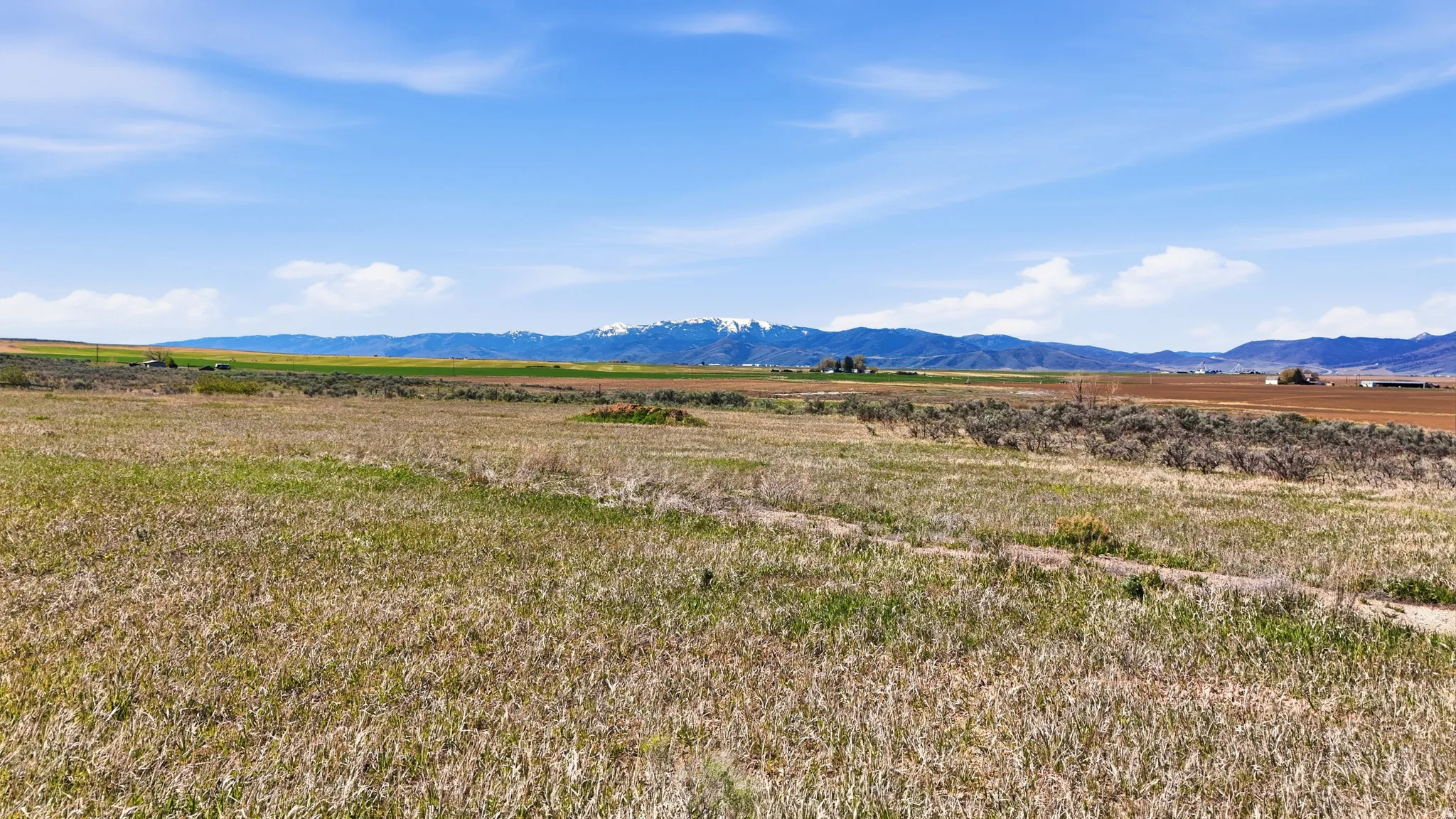 View of mountain background featuring rural landscape