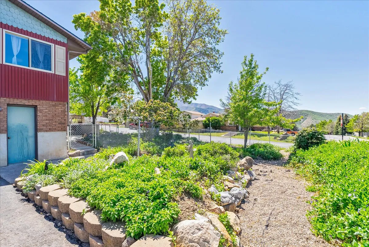 View of yard featuring a mountain view and garden
