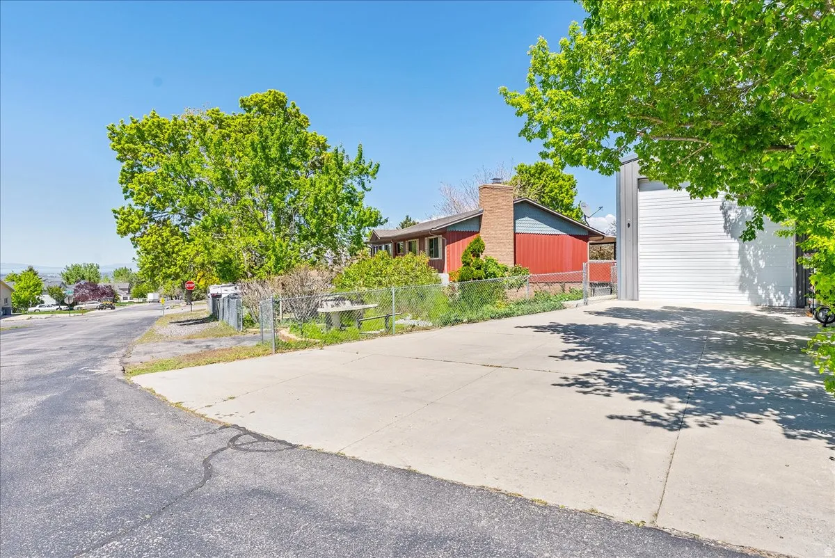 View of mid-century modern home and detached Garage