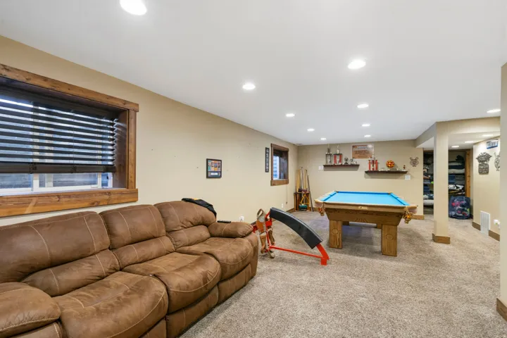 Recreation room with billiards table, recessed lighting, carpet floors, and plenty of natural light
