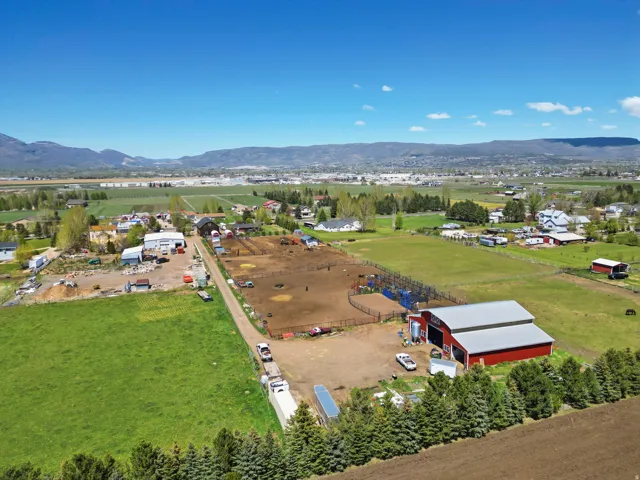 Aerial view of property's location with a mountainous background and rural landscape