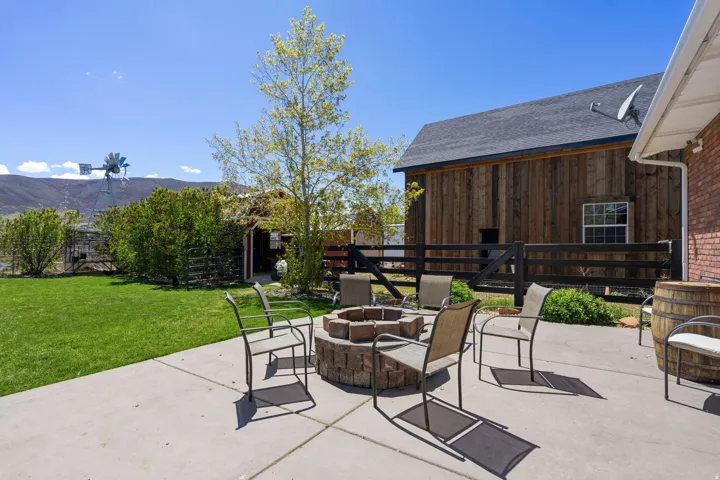 View of patio / terrace with a fire pit and views of Timpanogos Mountain