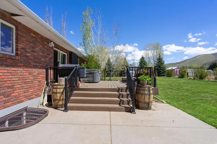 View of patio / terrace with a deck with mountain view