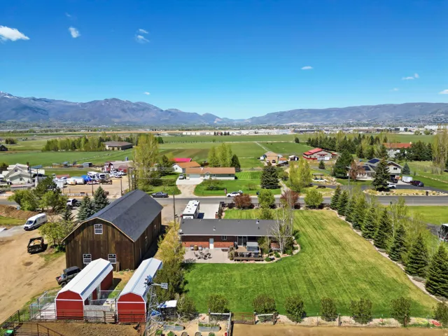 Overview of rural landscape featuring a mountain backdrop