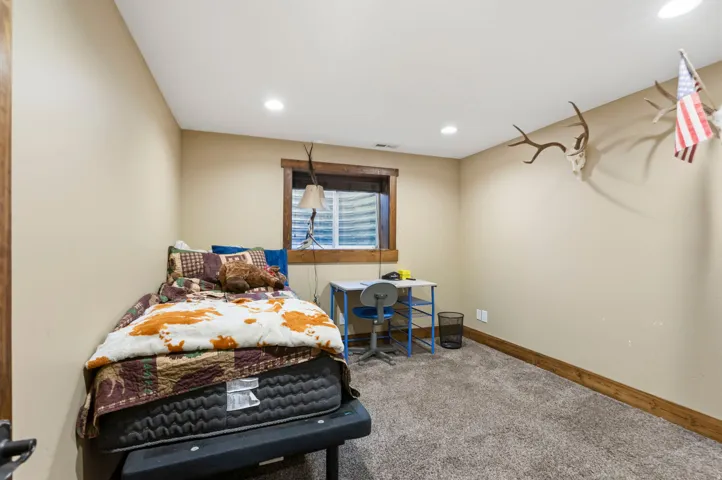 Bedroom with carpet flooring and recessed lighting