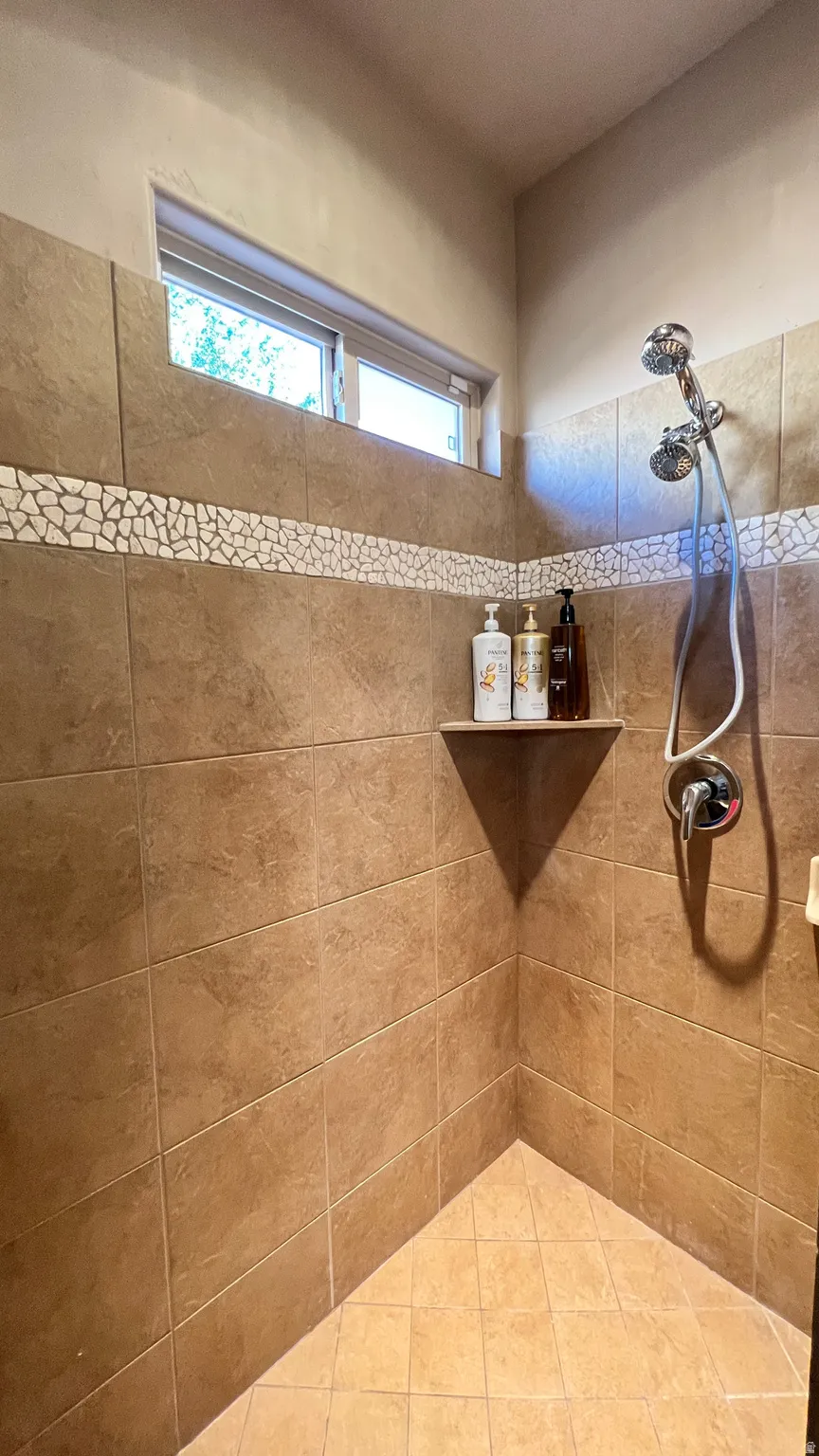 Full bathroom featuring tiled shower