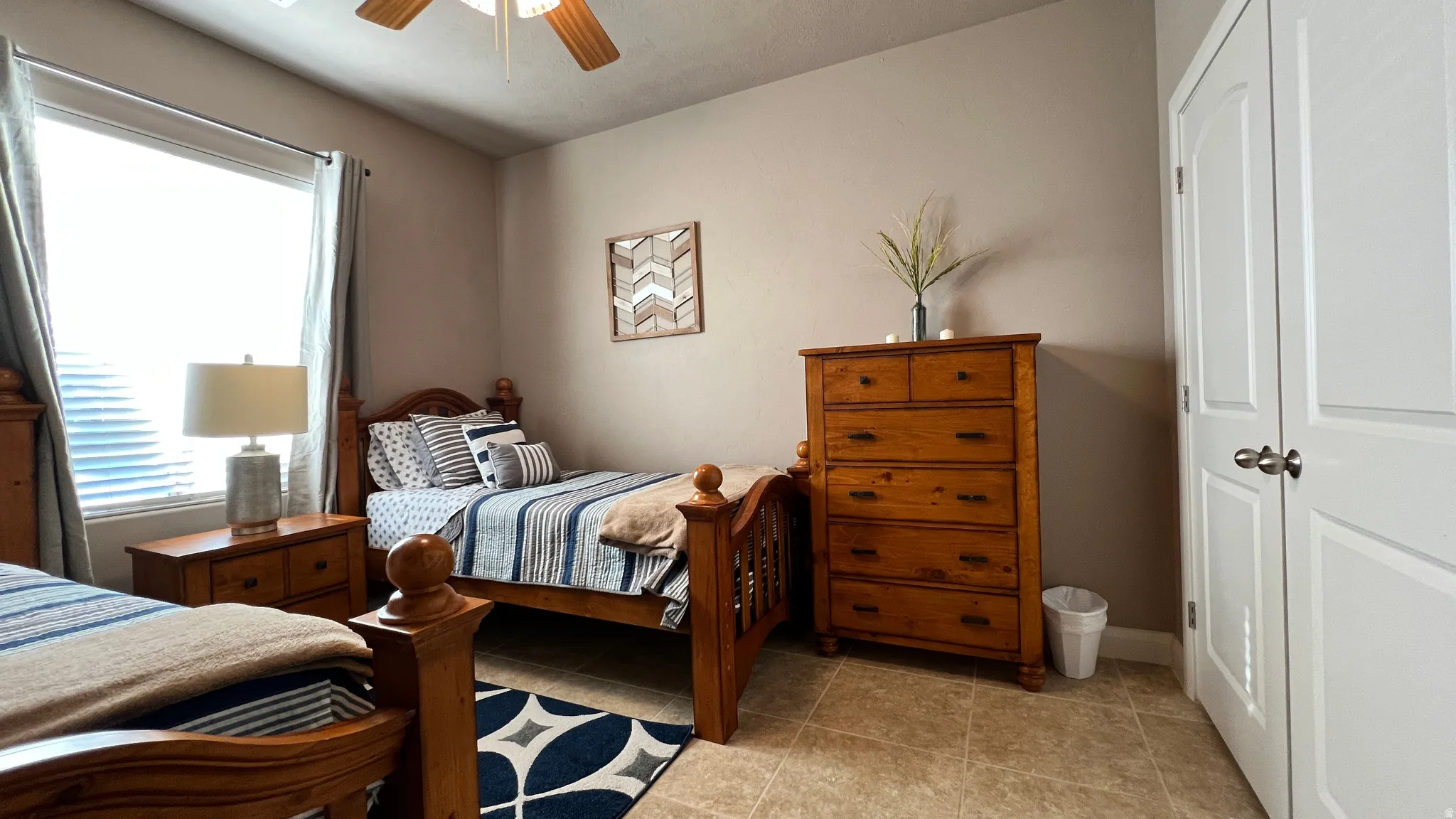 Bedroom with a closet and ceiling fan