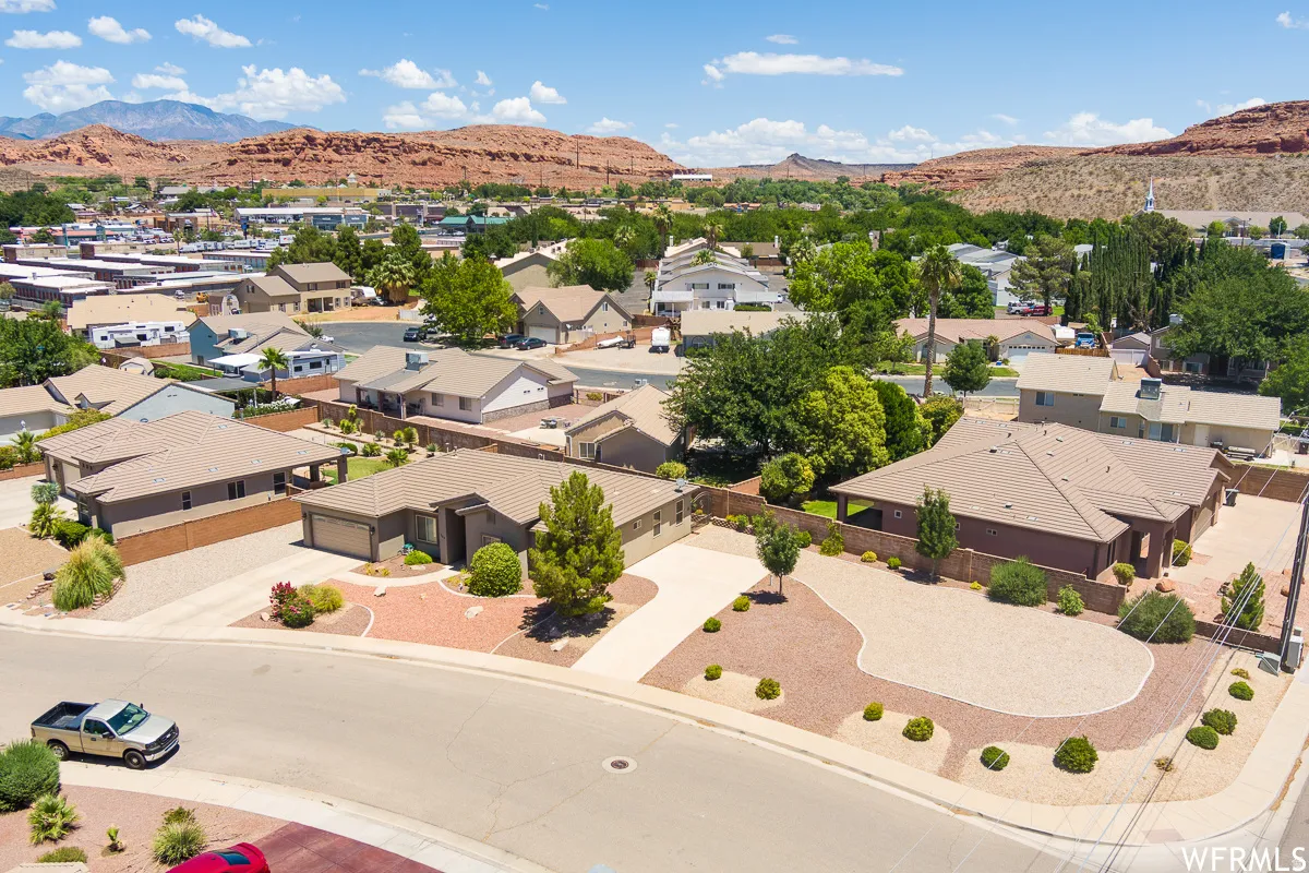 Aerial perspective of suburban area featuring a mountain backdrop
