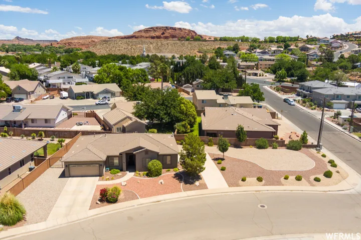 Aerial view of residential area featuring a mountainous background