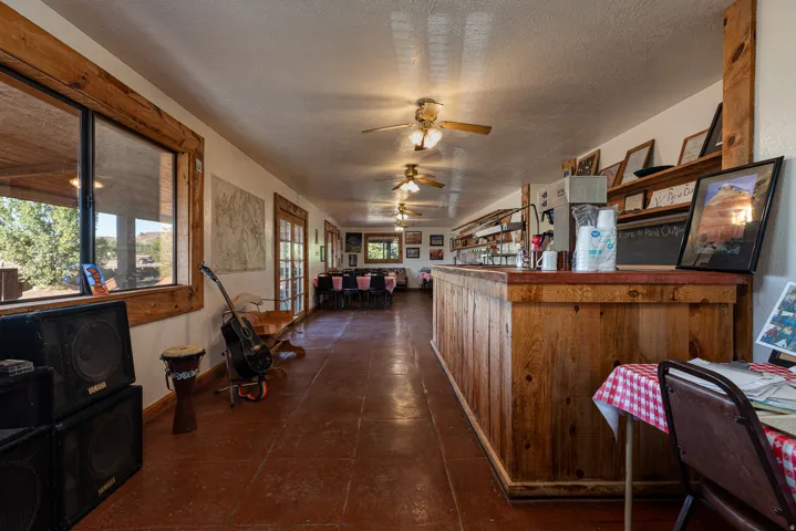 Kitchen featuring a ceiling fan and a textured ceiling