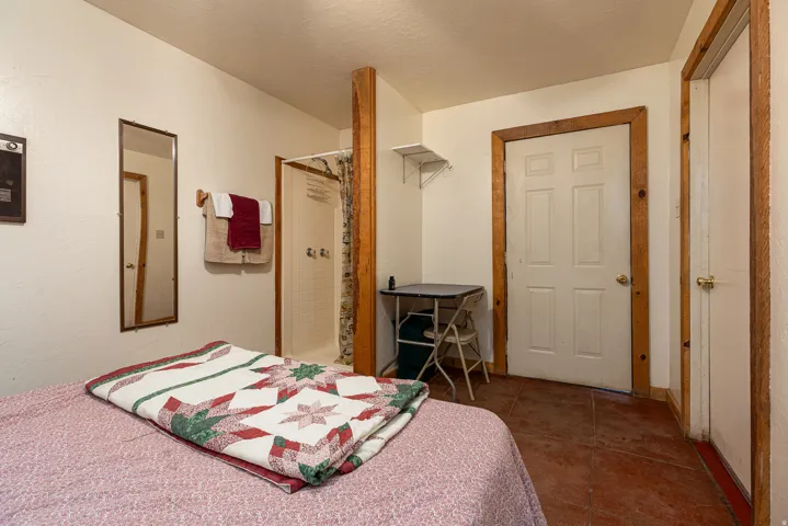 Bedroom featuring dark tile patterned floors