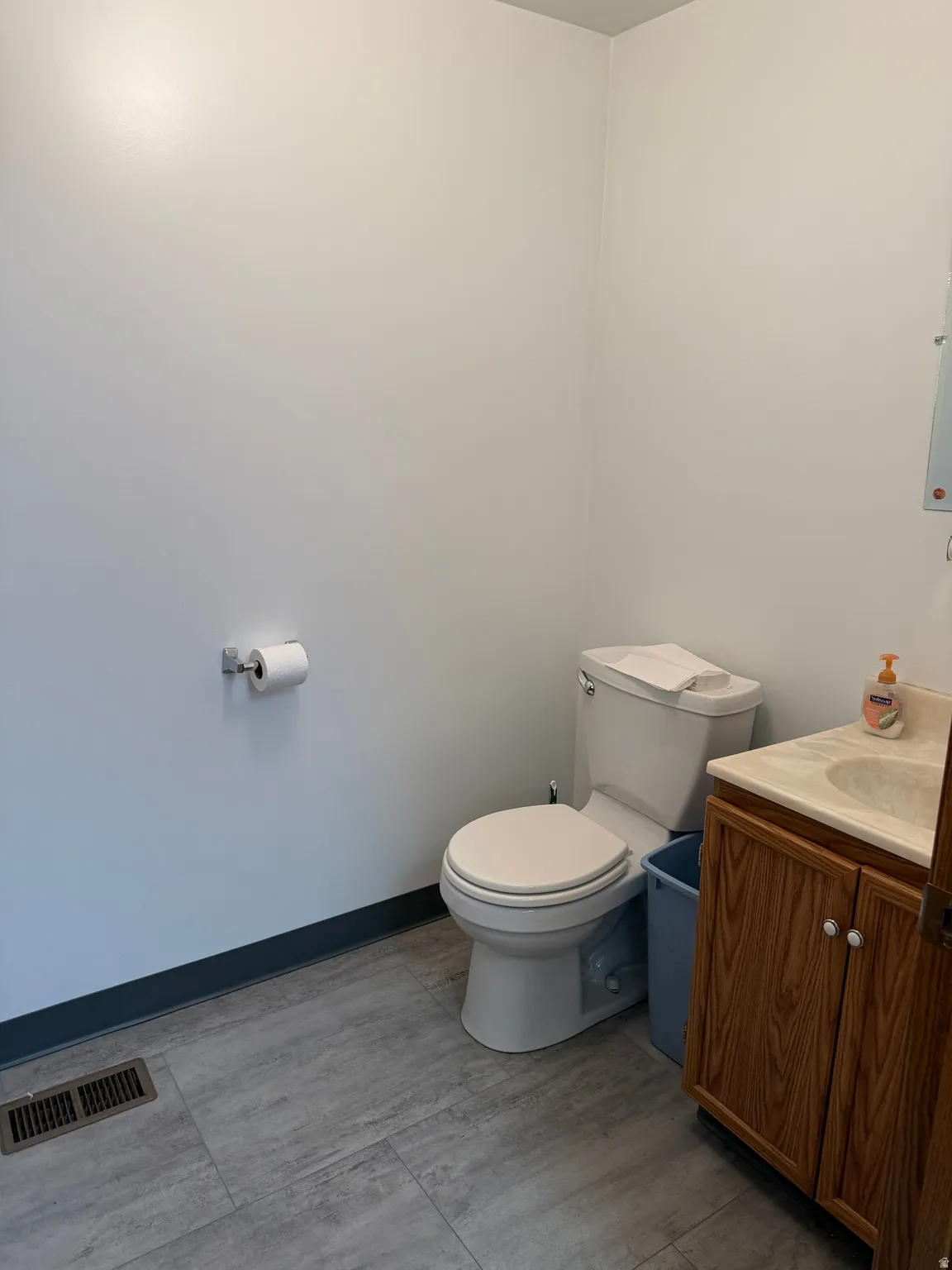 Half bath with vanity and toilet