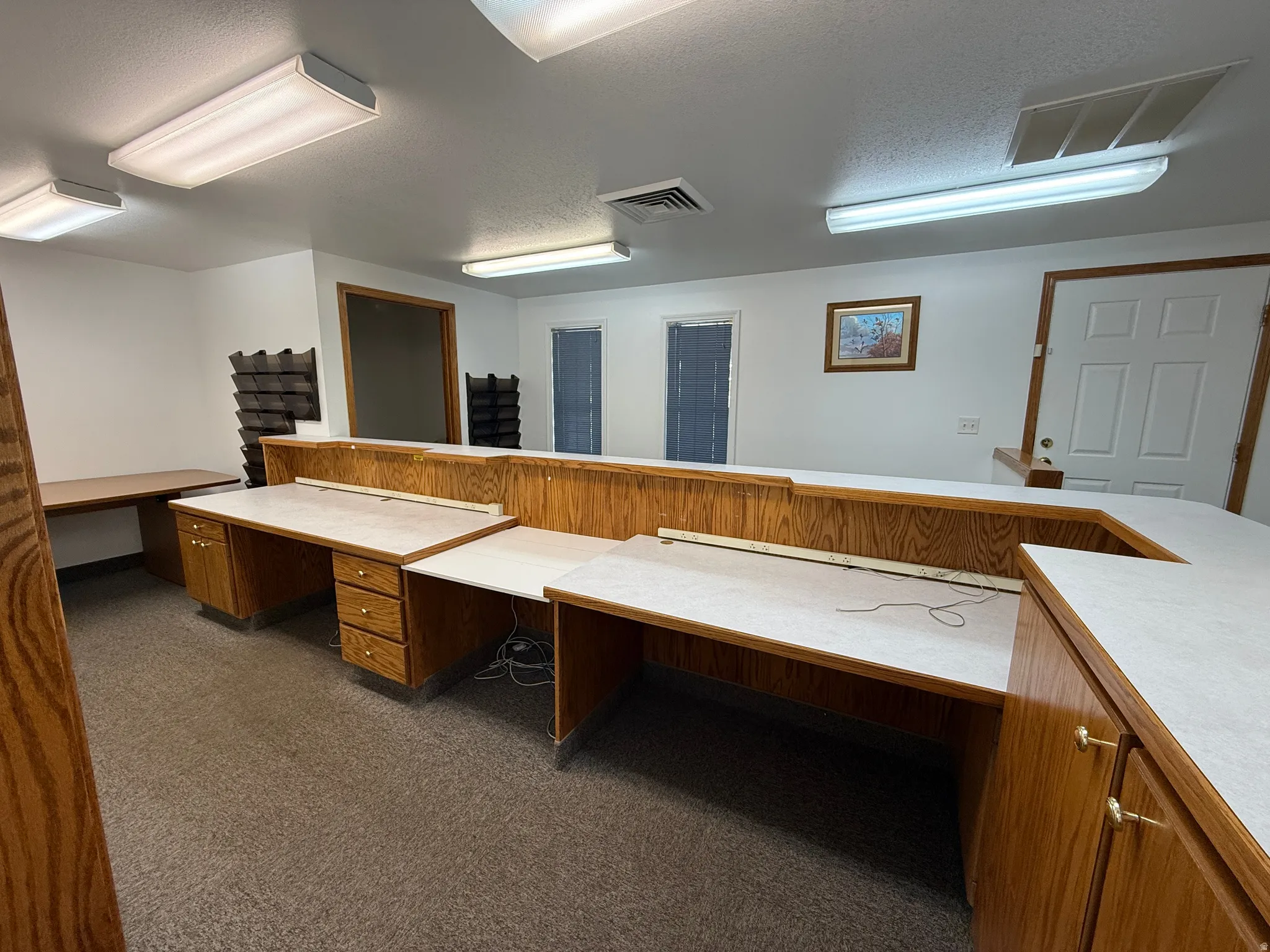 Unfurnished office featuring a textured ceiling