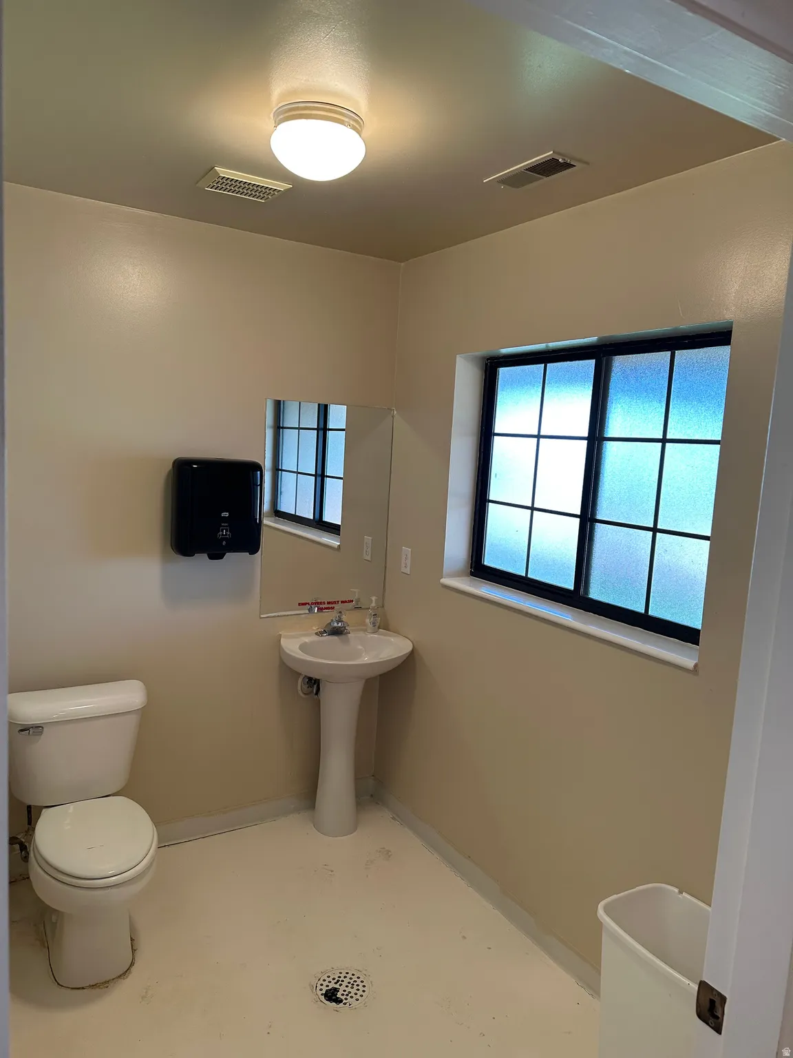 Bathroom featuring healthy amount of natural light and a freestanding bath