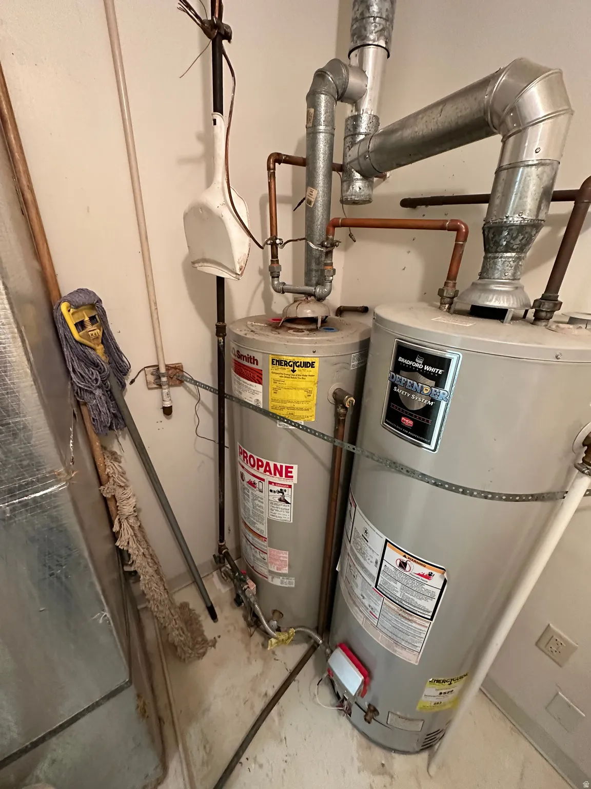 Utilities featuring strapped water heater