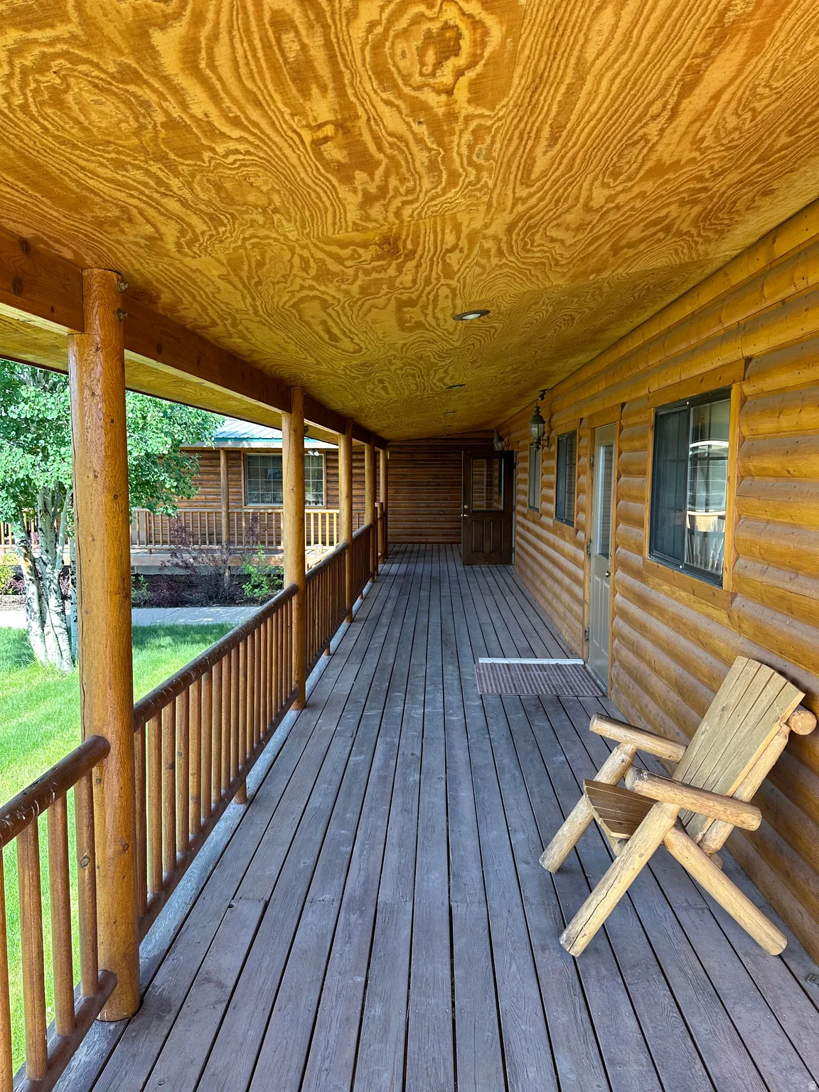 Porch featuring a yard