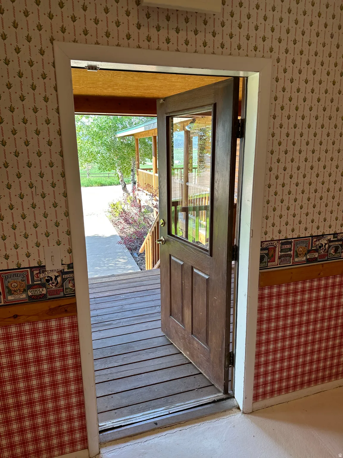 Doorway with wallpapered walls