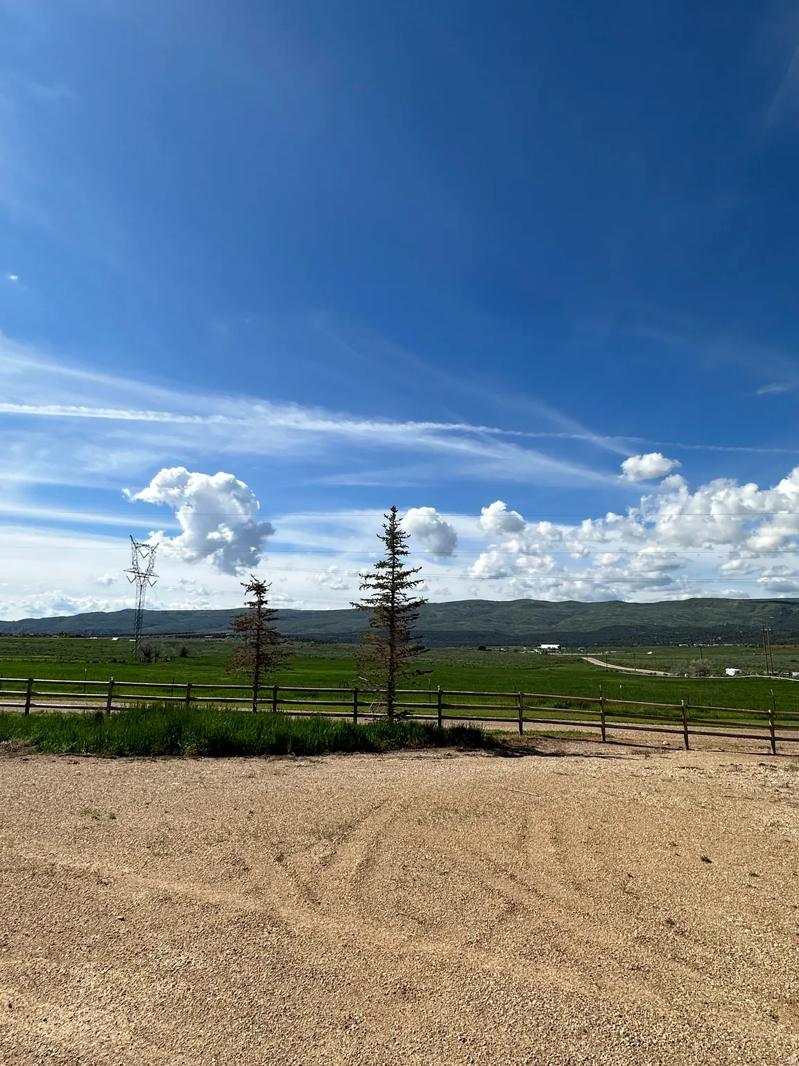 View of yard featuring a view of rural / pastoral area and a mountain view