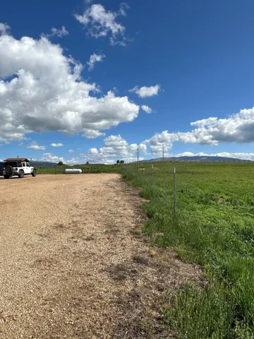 View of dirt / gravel road with a view of countryside