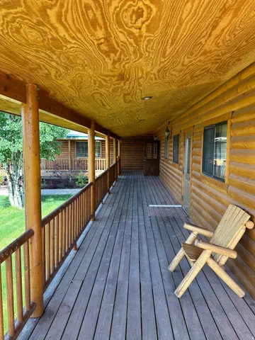 Porch featuring a yard