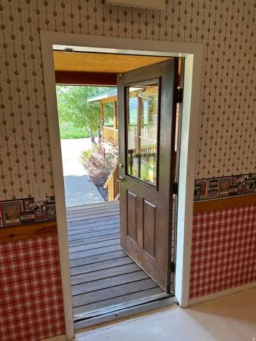 Doorway with wallpapered walls