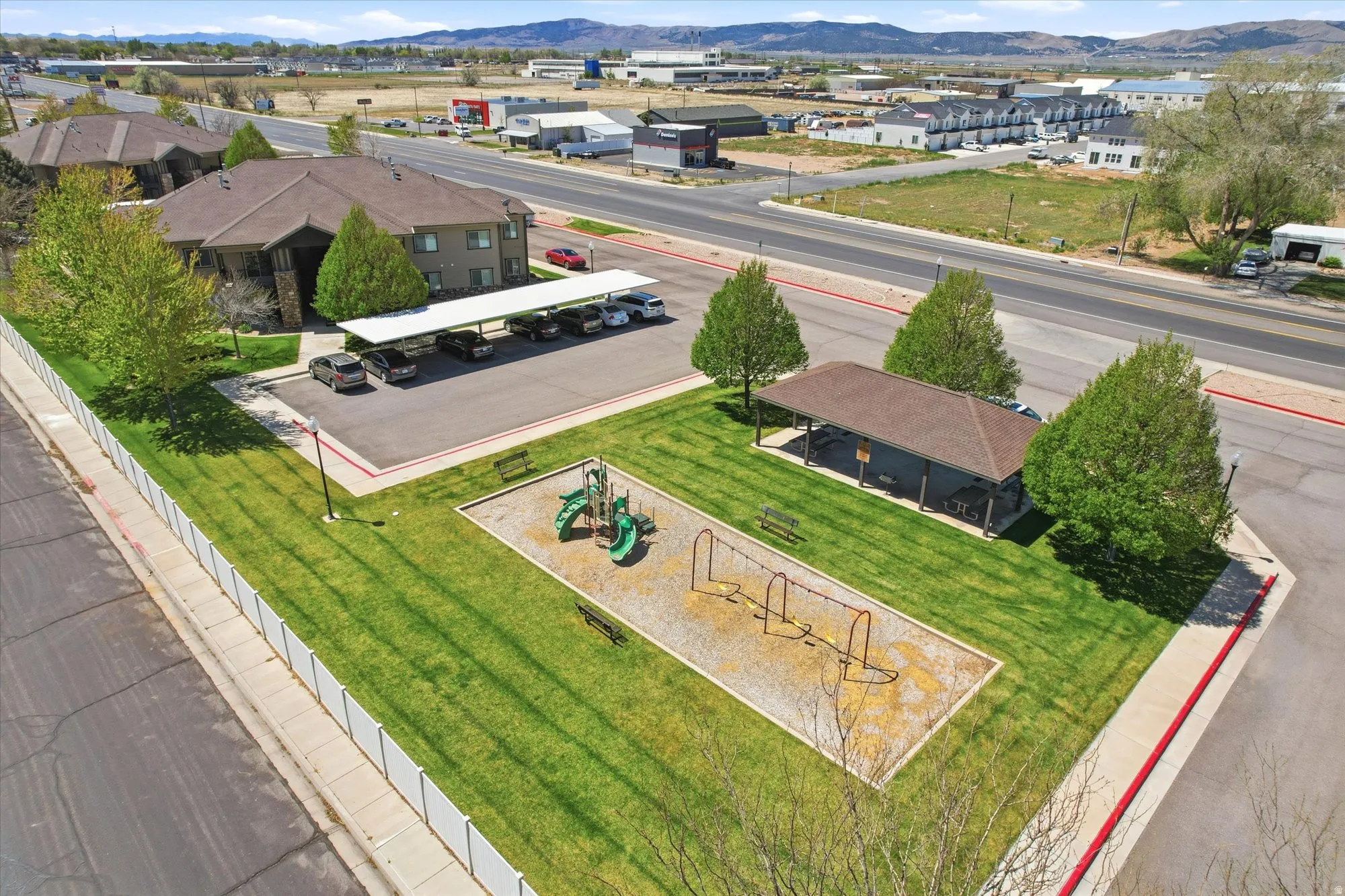 Aerial view of residential area featuring a mountainous background
