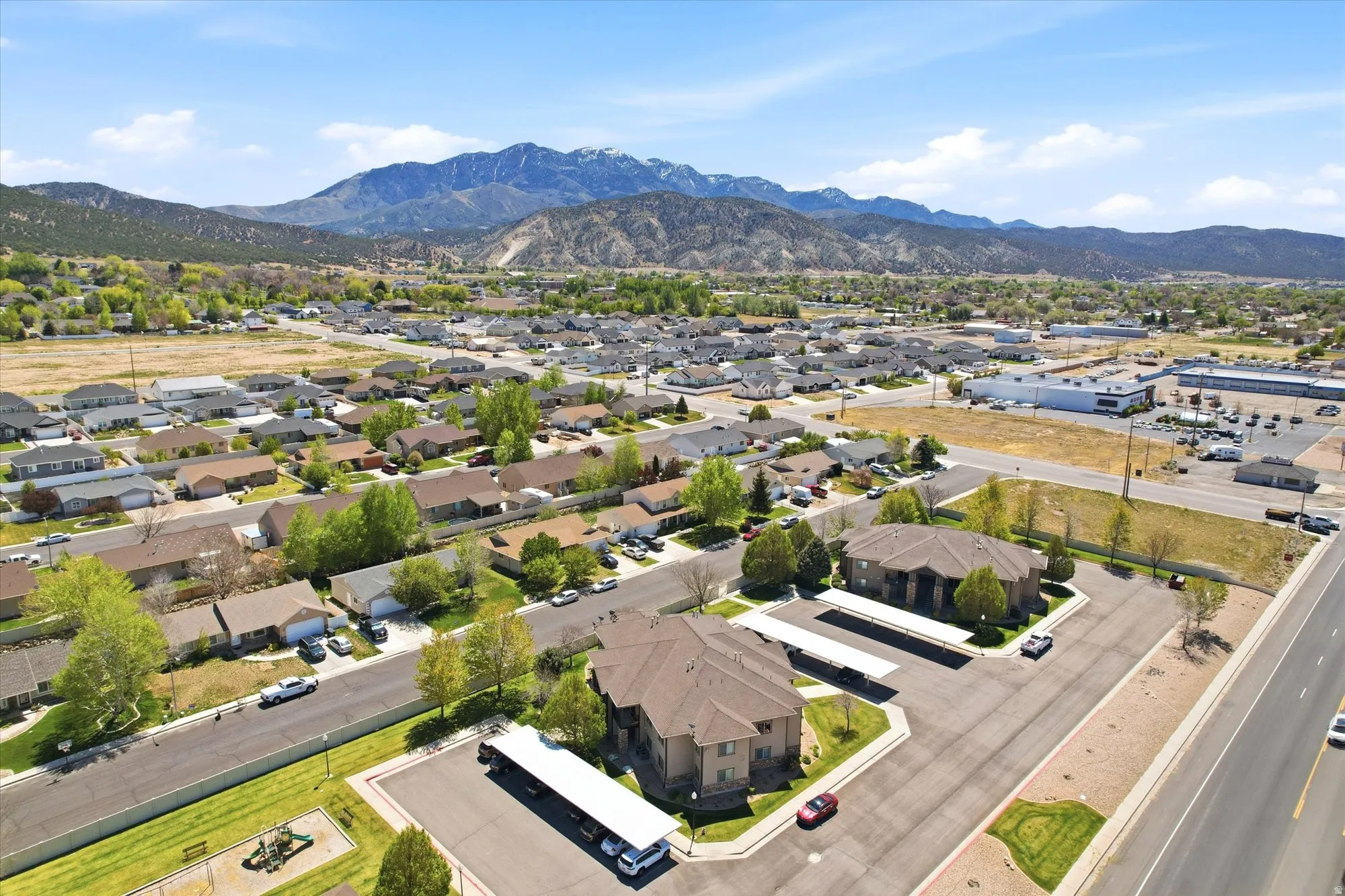 Aerial perspective of suburban area with a mountain backdrop