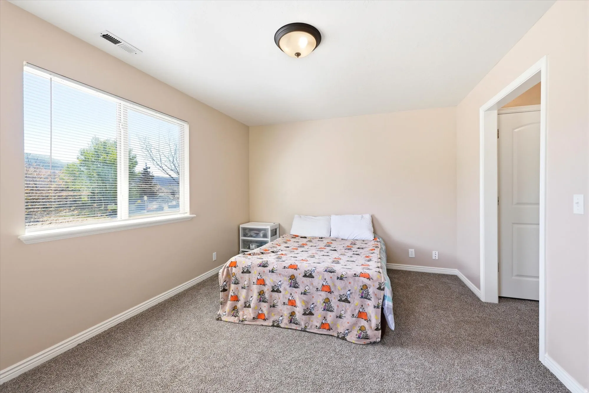 Bedroom with baseboards and carpet floors